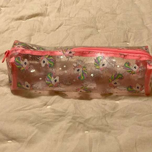 A pink, white, clear unicorn pouch. From: H&M. Name: Unicorn Pouch - Picture 2 of 5